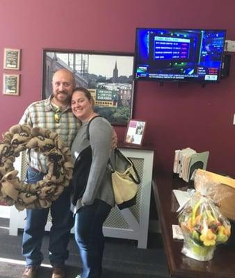 Two of our satisfied customers at  closing in our Wayne office. As a closing gift, we gave a personalized wreath and an edible arrangement.