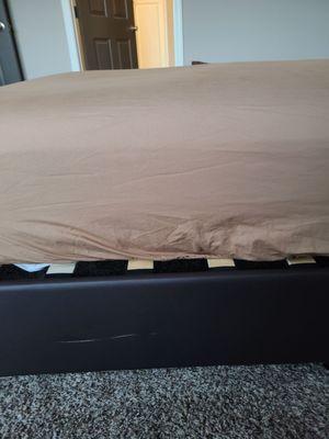 Scratched bed frame.