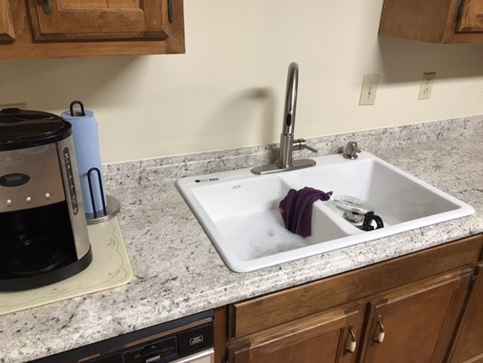 Installed counter tops, sink, and fixtures.