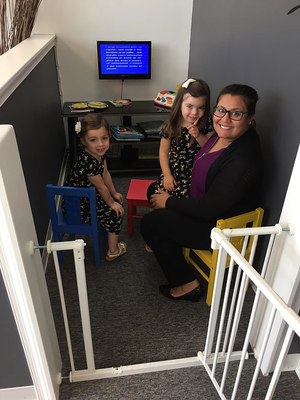 Dr. Patel catching a movie with some of our younger patients in the play area.