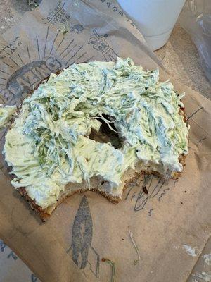 Stale everything bagel with clumpy, stringy, inedible chive cream cheese.