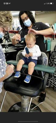 Cute little guy getting a haircut