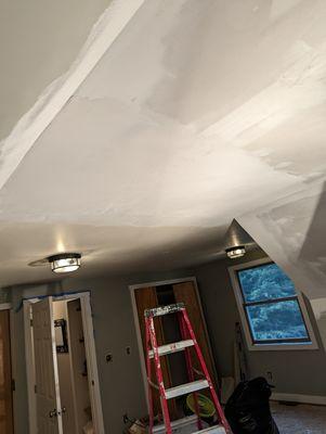 New door install drying with paint.  Second coat of mud drying on new drywall repair.