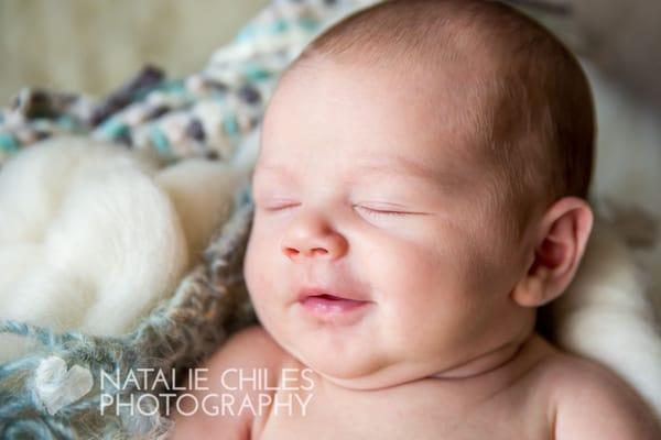 Sweet smiles abound when baby is relaxed and settled.