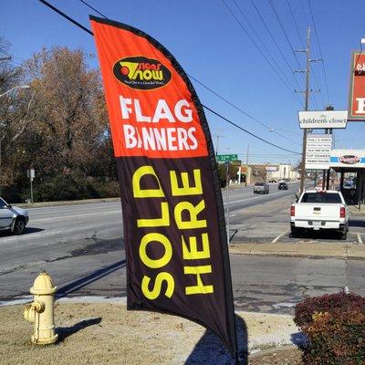 9 Foot Flag Banner with Ground Stake and Custom Art. Available for ordering at Signs Now Tulsa