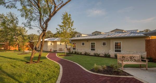 Secure, expansive backyard with wandering paths designed for those who use walkers and wheelchairs.