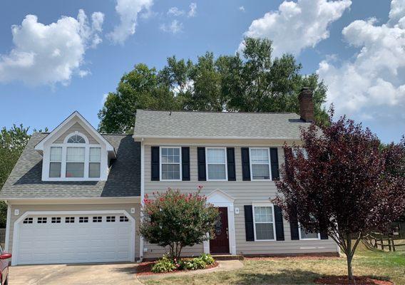 Finished roof job with new garage door and exterior paint!