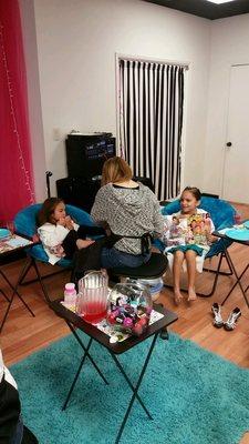 Isla with her cousin getting pampered  it's rough being 7