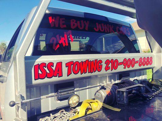 View of Issa Towing tow trucks with information