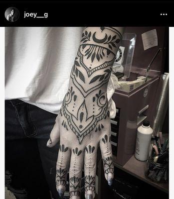 hand tattoo by Joey