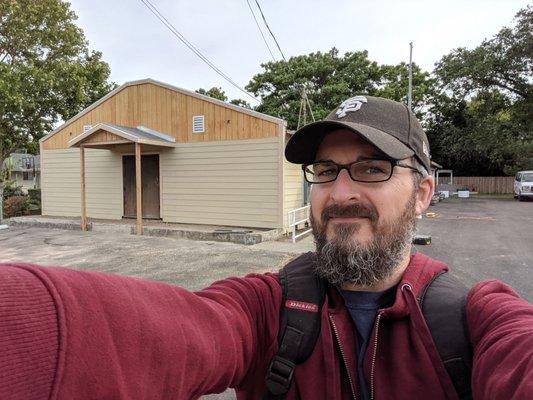 Selfie with the Pastor and the church building.