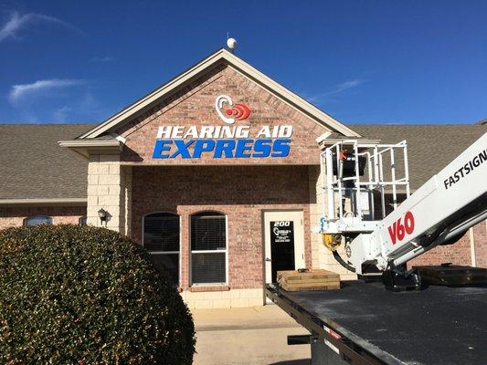 The day our new sign went up on the store-front!