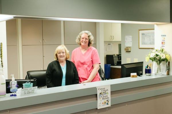 Medical Assistants  Janette and Debra greet visitors at the door