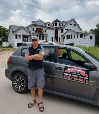 Roofer Mike supervising a roofing & siding installation  in Lincoln, NE.