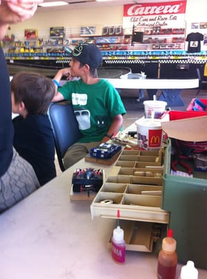 Boys waiting to get their slot car on the track