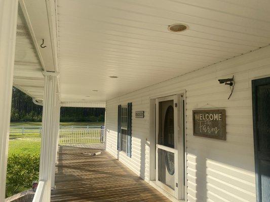 Huge house power washed wrap around porch and siding