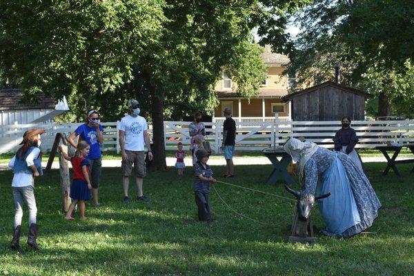 Visitors are invited to participate in the activities happening on the historic grounds. Here a young cowboy takes a turn at roping.