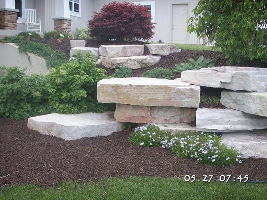 Byron Center residence using dark brown color enhanced mulch