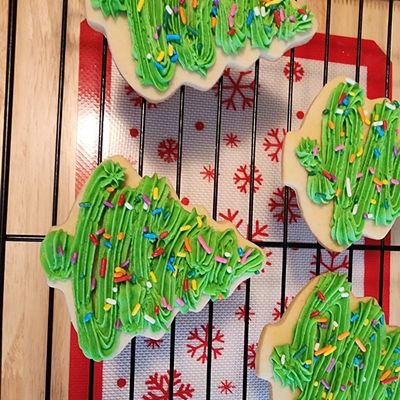 Cut-out sugar cookies with frosting and sprinkles.