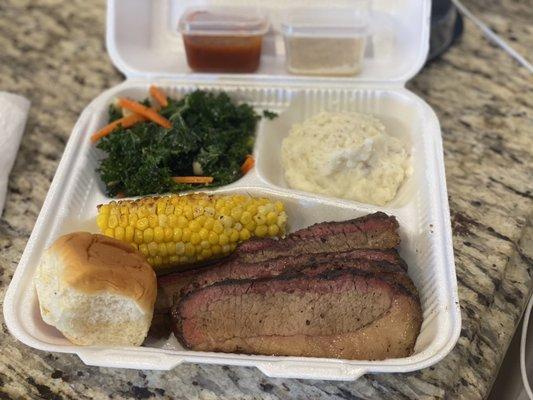 oak wood smoked brisket, honey buttered roasted corn, garlic mashers, and apple kale slaw.