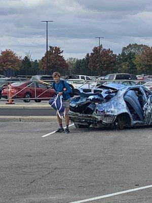 Bro chilling in da parking lot