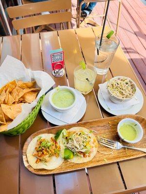 Salmon tacos, fresh chips, Yummy green salsa, a side of spicy slaw & a Pineapple Jalapeño Margarita! All delicious!