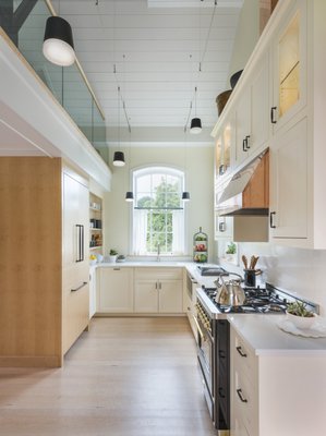 White cabinetry in a Watch Hill, RI kitchen. Architect - Michael McKinley and Associates.