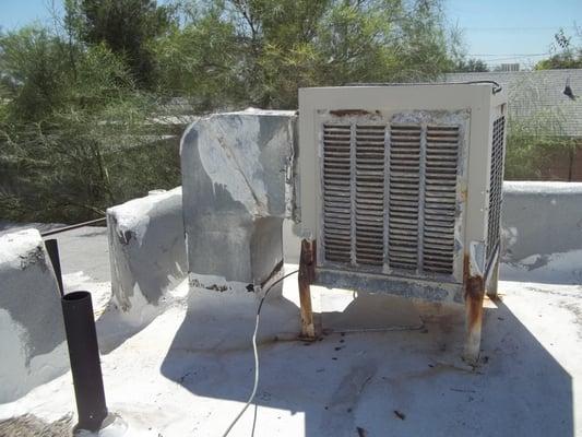 This evaporative cooler is in replacement condition.