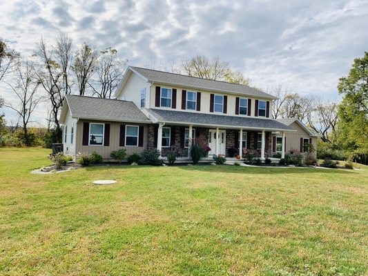 2-story with board and batten, stucco and stone exterior.