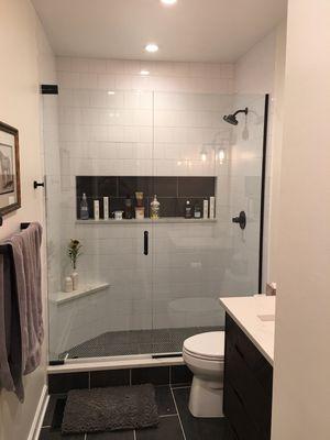 Custom built shower with a linear niche