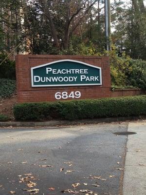 The sign on Peachtree-Dunwoody Rd at the front of the complex.