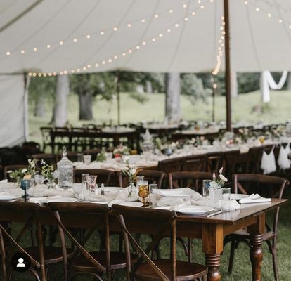 Sail cloth, crossback chairs, farm tables and added elegance from North Country Vintage with multicolored wine glasses for colorful flair!