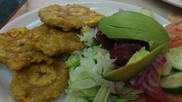 Tostones y Ensalada: Twice fried green plantains & salad (iceberg lettuce, red onion, beets, tomato, cucumber, avocado)