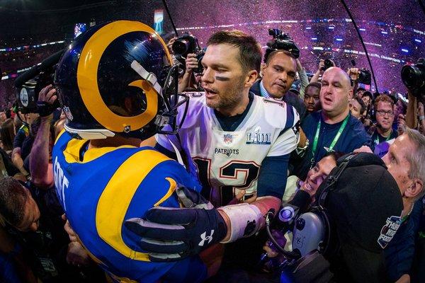 LA Rams qb Jared Goff (16) and New England Patriots qb Tom Brady (12) embrace following NFL Super Bowl 53, on Feb. 3, 2019, Atlanta. (P.A.)