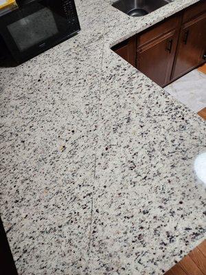 Long black line in granite countertop.