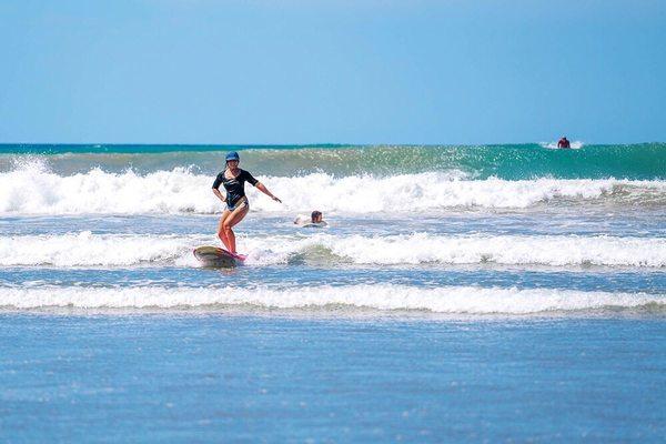 The waves here are perfect for beginners. You're bound to get up on that board...maybe even on Day 1!