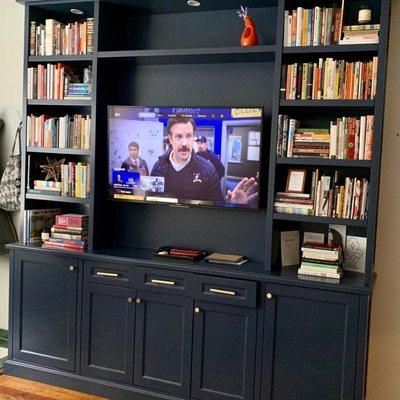 Installed in Philadelphia, PA. Custom entertainment center. Maple wood with adjustable shelves, self closing drawers and soft closing doors