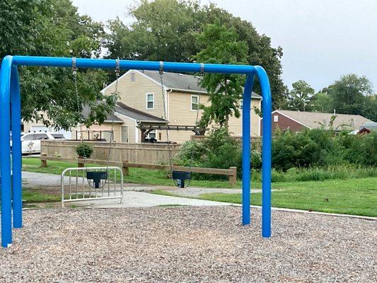 Two baby/toddler swings available and a bike rack