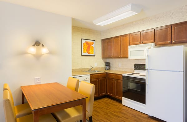 Kitchens in our Two Bedroom Suites have full-sized ovens and extra seating.