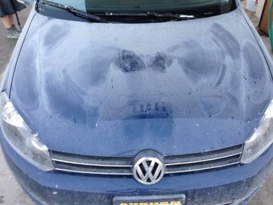 The "before" shot (someone had jumped on my hood and made a sand angel to show how dirty it was).