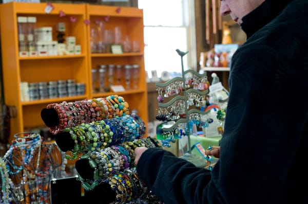 A shopper perusing Nabos' wide variety of jewelry.