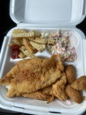 Fish plate with fries, hush puppies, & coleslaw