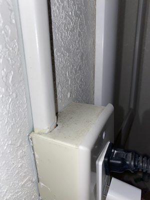 Dirt on top of outlet.