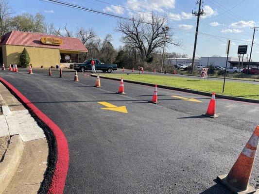 Asphalt and striped lot.