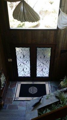 View of entry doors from foyer balcony