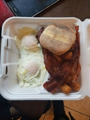 2 egg with meat breakfast platter with eggs over medium