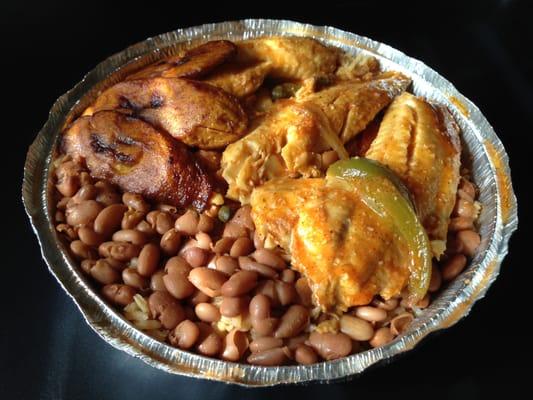 Coconut-flavored Tilapia with yellow rice, beans, and plantain.