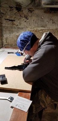 Rick hand scribing on an Idaho plaque.