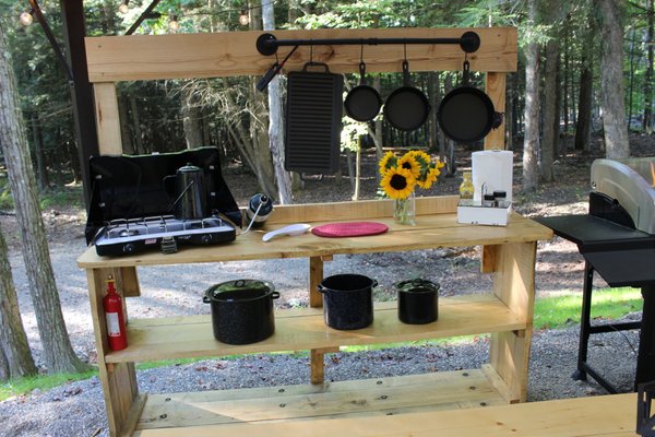 Outdoor kitchen with cast iron pans for a wonderful breakfast or dinner.