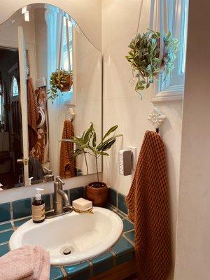 Bathroom with fresh towels and hand soap in Santa Monica studio